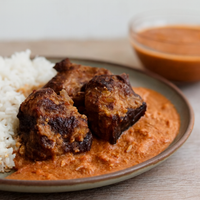 Smoked Turkey Stewed in West African Gravy